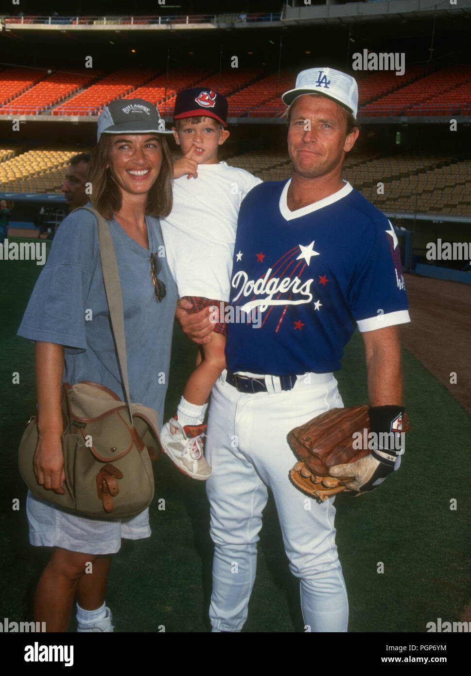 LOS ANGELES, CA - AUGUST 22: (L-R) Actress Amanda Pays, son Oliver Bernsen and actor Corbin Bernsen attend the 35th Annual 'Hollywood Allstars Night' Celebrity Baseball Game on August 22, 1992 at Dodger Stadium in Los Angeles, California. Photo by Barry King/Alamy Stock Photo Stock Photo