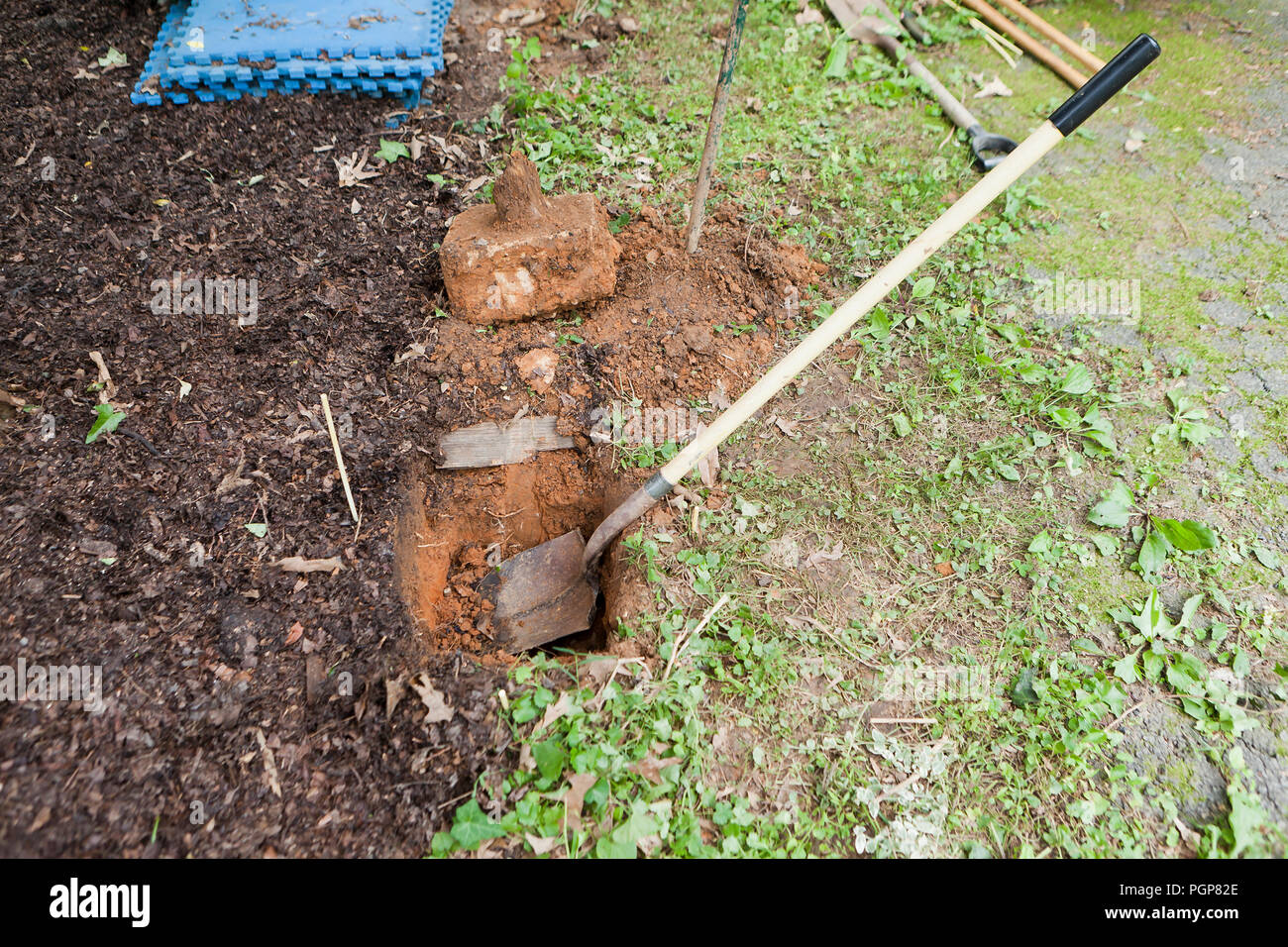 Fence post holes in ground during fence repairs - USA Stock Photo
