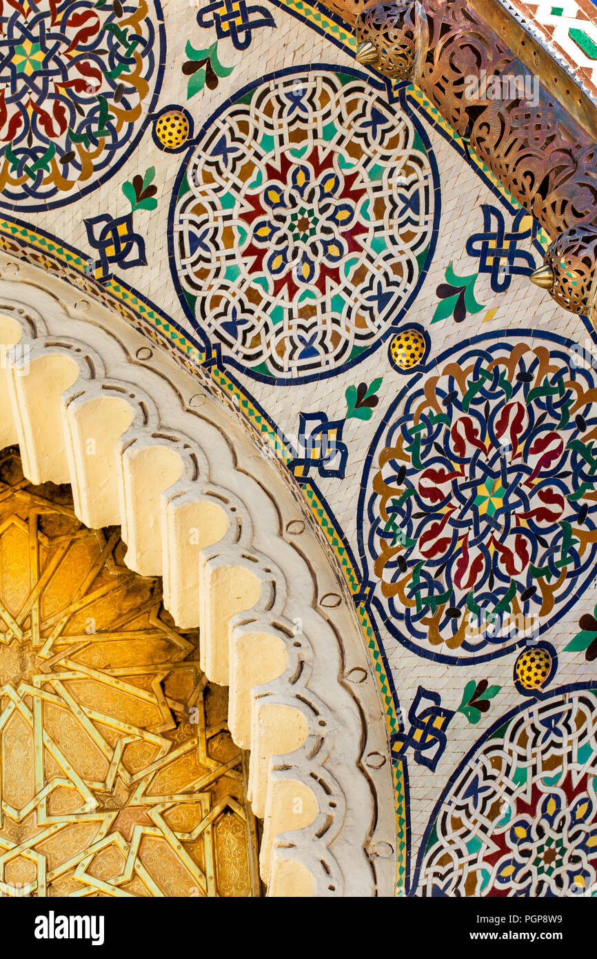 Morocco royal palace doors in Fes, close up detail of intricate mosaic tile design and ornamental metal trim. Fantastic example of Moroccan artistry Stock Photo