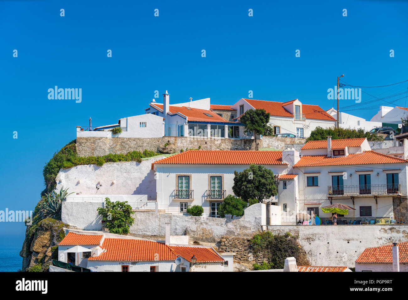 Azenhas do Mar stunning village built on a rock on the atlantic coast near Sintra, Portugal Stock Photo