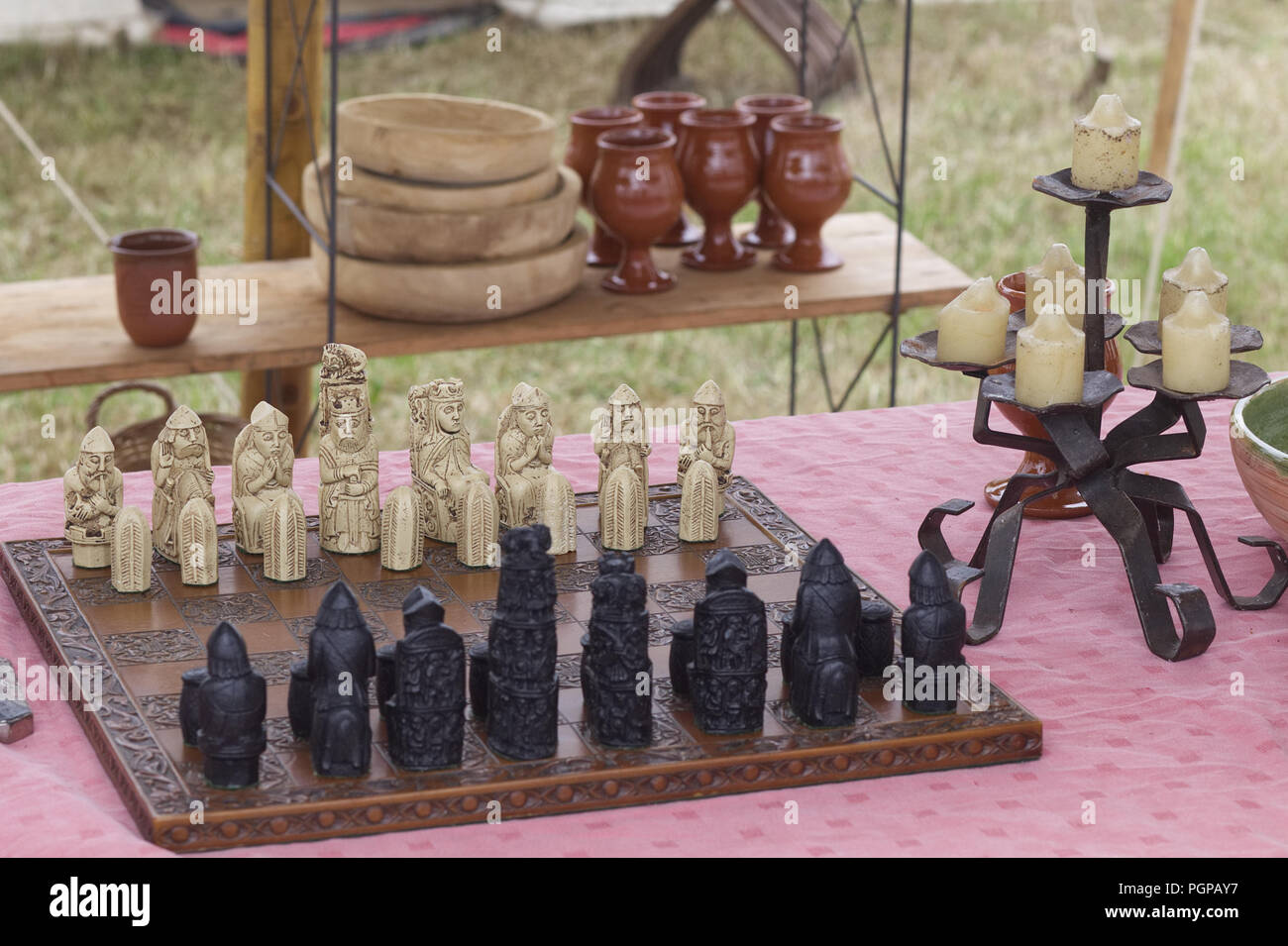 Medieval chess set on a banquet table Stock Photo
