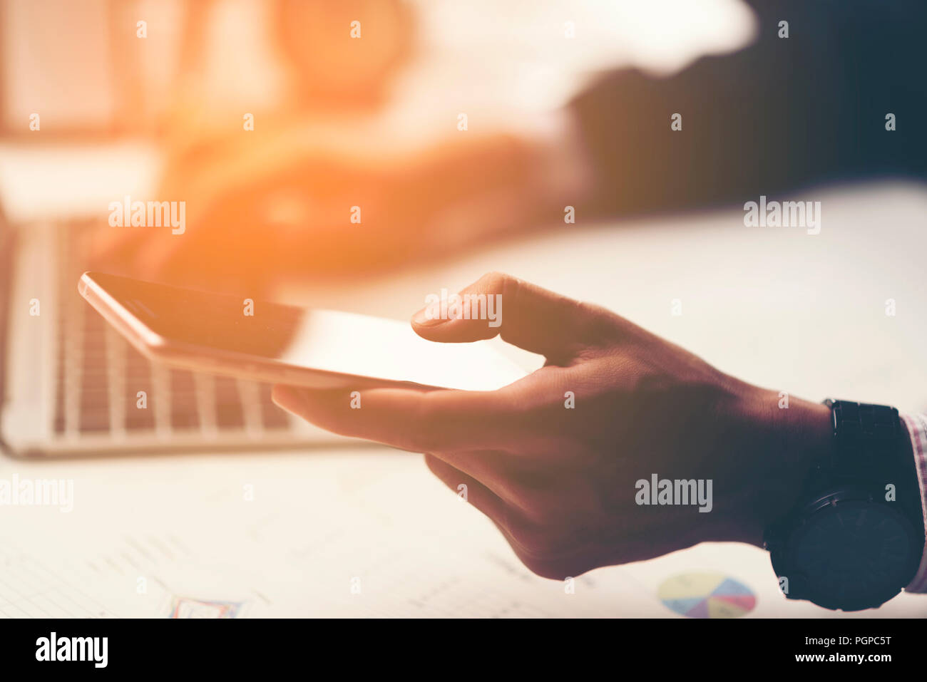 businessman using tablet smartphone for working in the office Stock Photo