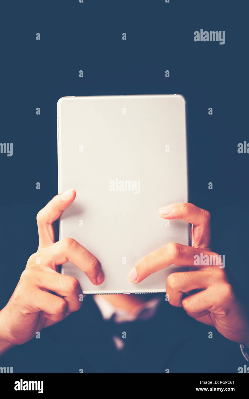 businessman using tablet smartphone for working in the office Stock Photo