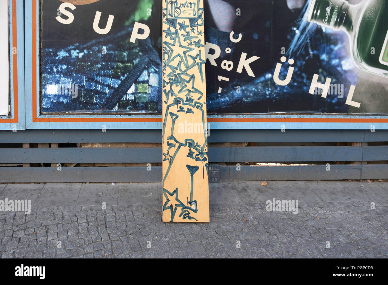 Berlin-Mitte. Opprtunistic street art. Street artist uses found wood ...