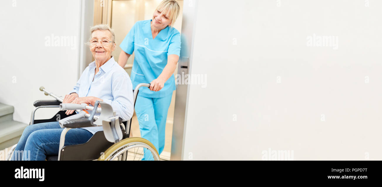 Old woman in wheelchair with walking aids is being cared for by a nurse  Stock Photo - Alamy