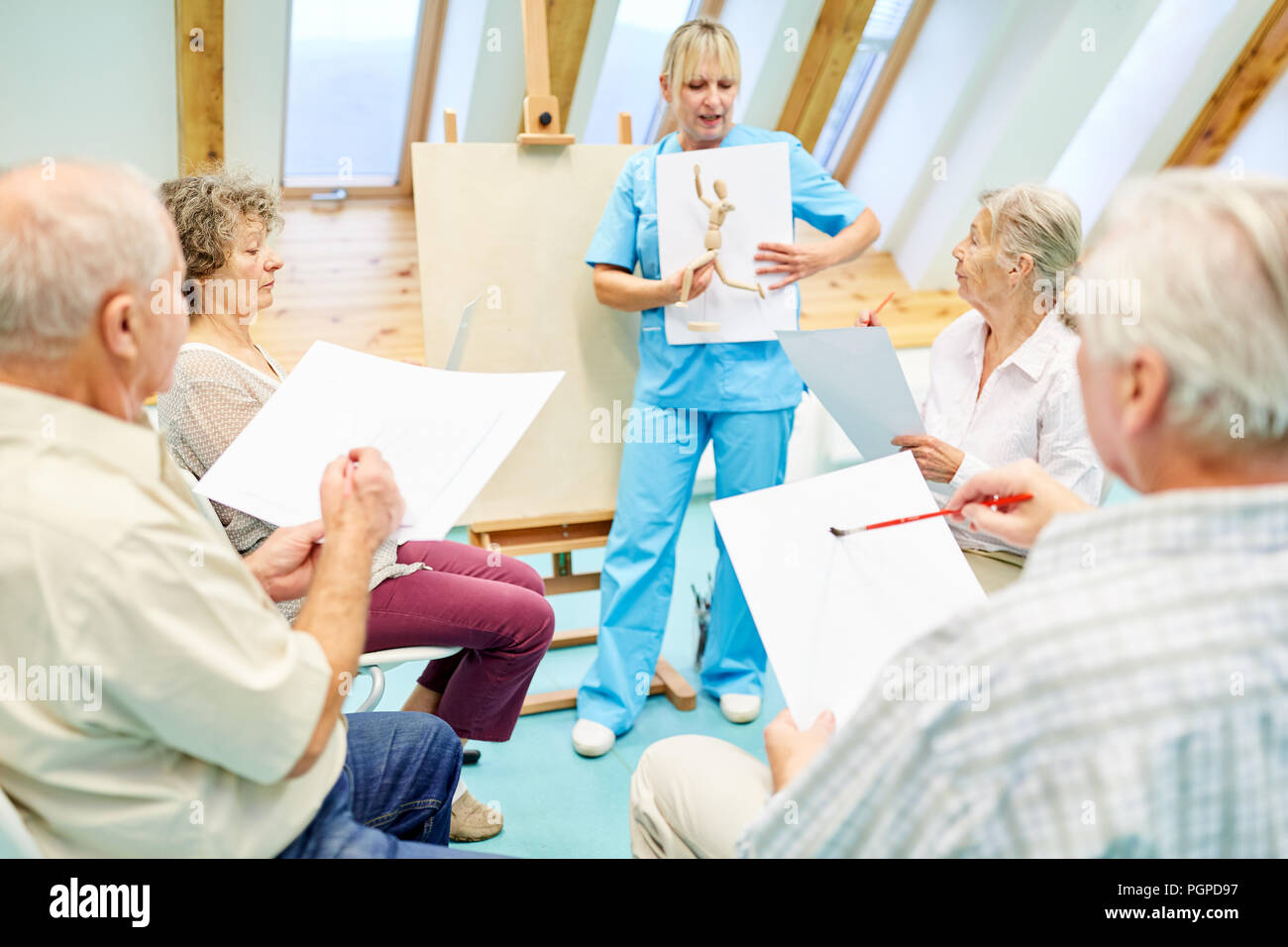 Creative painting course or drawing course for seniors with dementia as