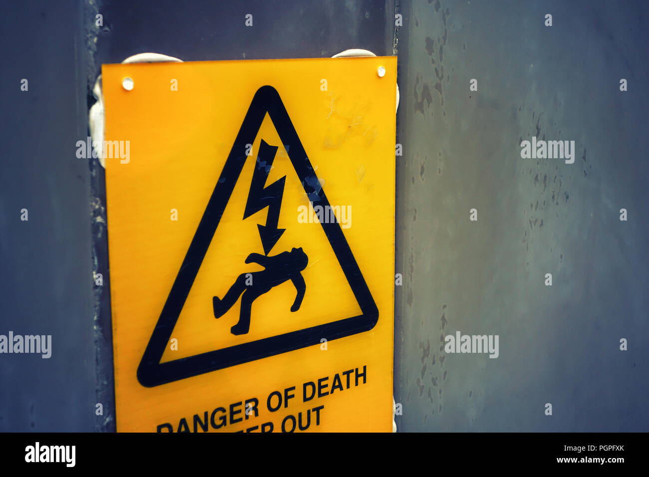 Danger of Death sign. Getting electrocuted causing death or serious injury caused by electric shock, electric current passing through the body. Stock Photo