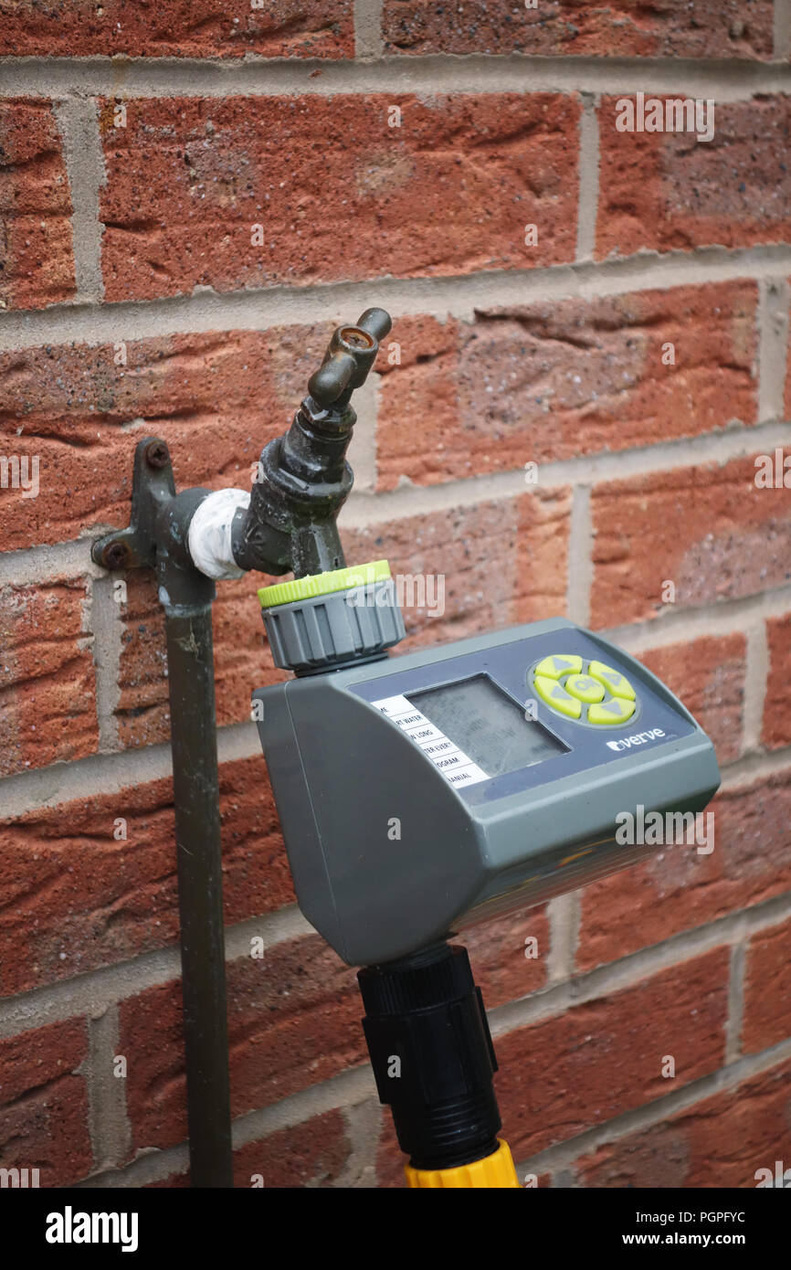 Automatic garden watering system control unit mounted on a wall in Rotherham, South Yorkshire