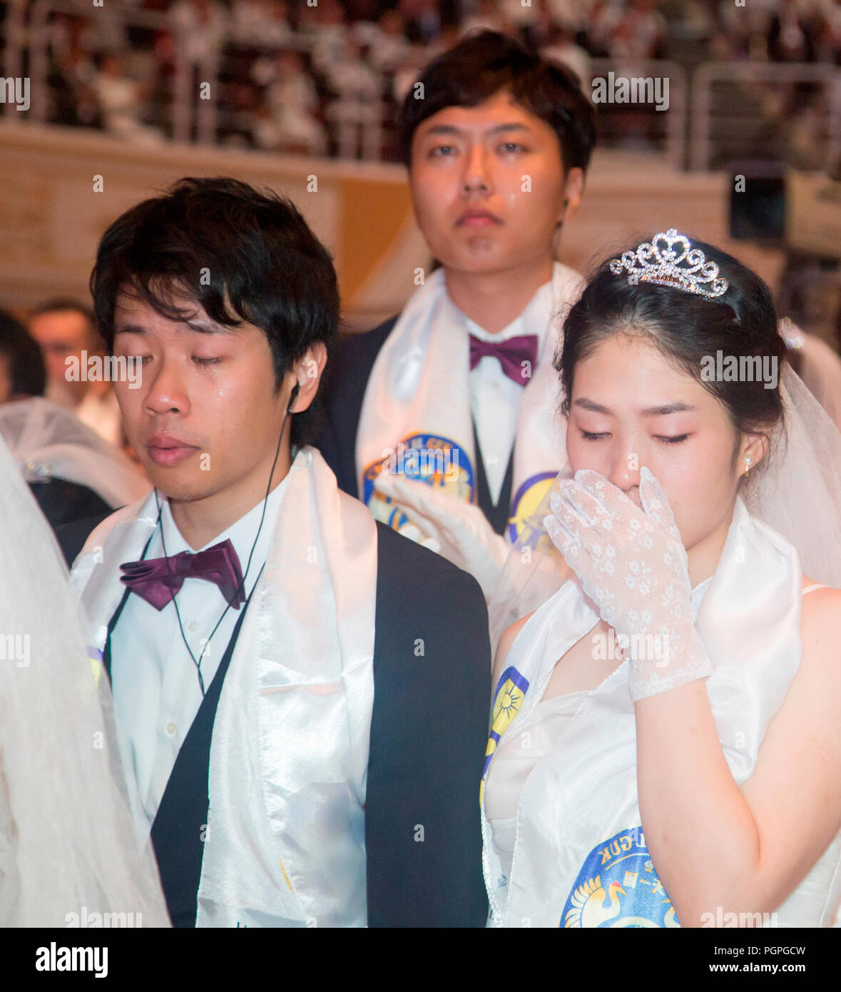 Seoul, South Korea. 27th Aug 2018. Mass wedding ceremony of the Unification Church, Aug 27, 2018 : Couples from Japan pray during a mass wedding ceremony of the Unification Church at the CheongShim Peace World Center in Gapyeong, about 60 km (37 miles) northeast of Seoul, South Korea. Four thousand newlywed couples from around the world participated in the mass wedding on Monday, which was organized by Hak Ja Han Moon, wife of the late Reverend Sun Myung Moon. Credit: Aflo Co. Ltd./Alamy Live News Stock Photo