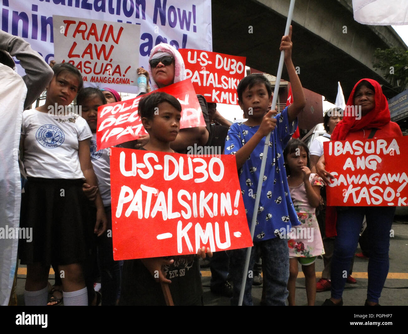 Manila, Philippines. 7th Feb, 2013. Young boys seen holding placards.Labor Union from different business sectors leads National Heroes' Day march to Mendiola. Labor coalitions will mark National Heroes' Day on Monday by protesting the Duterte administration's alleged failure to address workers' issues. Credit: Josefiel Rivera/SOPA Images/ZUMA Wire/Alamy Live News Stock Photo