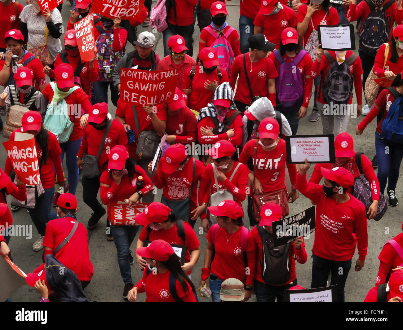 Manila, Philippines. 7th Feb, 2013. Protesters wearing red shirts marching along EspaÃ±a Boulevard going to Mendiola.Labor Union from different business sectors leads National Heroes' Day march to Mendiola. Labor coalitions will mark National Heroes' Day on Monday by protesting the Duterte administration's alleged failure to address workers' issues. Credit: Josefiel Rivera/SOPA Images/ZUMA Wire/Alamy Live News Stock Photo