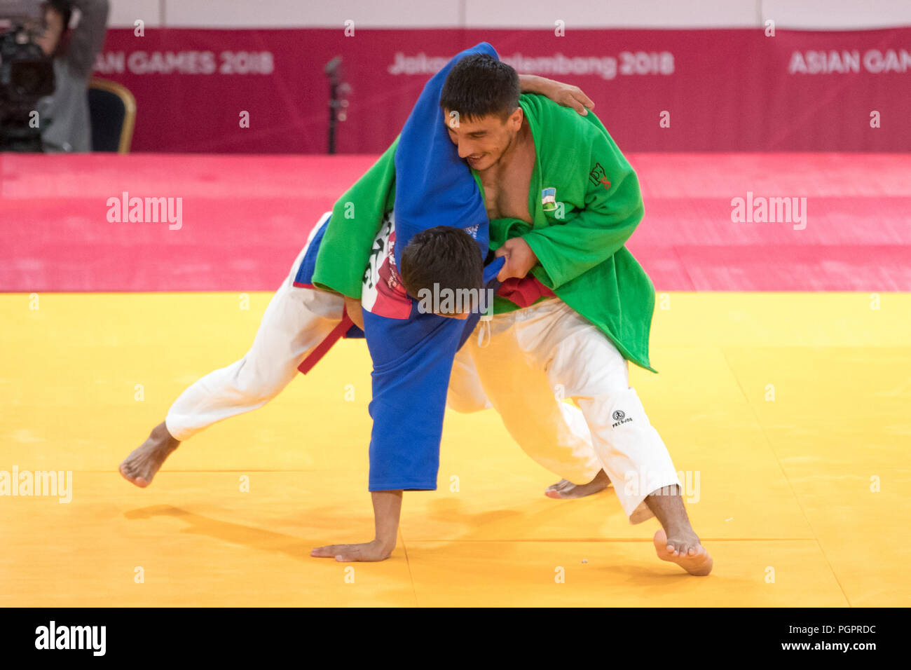 Jakarta, Indonesia. 28th Aug, 2018. Maruf Gaybulloev (R) of Uzbekistan  competes against Ruslan Buriev of Uzbekistan during the Kurash Men -66 kg  Final at the 18th Asian Games in Jakarta, Indonesia, Aug.