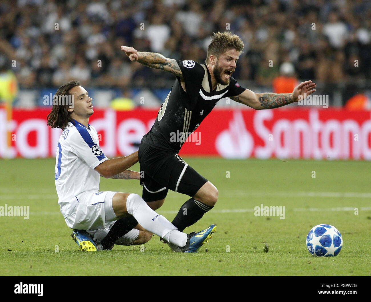 August 28, 2018 - Mykola Shaperenko ( R) of Dynamo vies with Lasse Schone (L) of Ajax during the UEFA Champions League play off, second leg soccer match between Ajax and Dynamo Kyiv in Kyiv, Ukraine, 28 August 2018 Credit: Anatolii Stepanov/ZUMA Wire/Alamy Live News Stock Photo