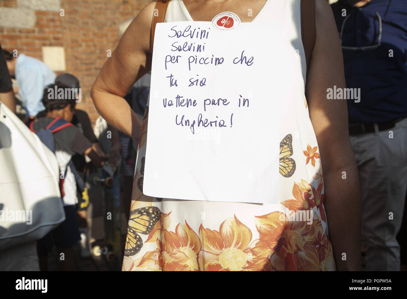 Milan, MI, Italy. 28th Aug, 2018. A protester is seen with a poster during the protest.Left-wing activists protest against the meeting of the Italian Deputy Premier and Interior Minister, Matteo Salvini, and the Hungarian Premier, Viktor OrbÃ¡n. Protestors refuse both common populist vision and anti-migrants' stances. Credit: Valeria Ferraro/SOPA Images/ZUMA Wire/Alamy Live News Stock Photo