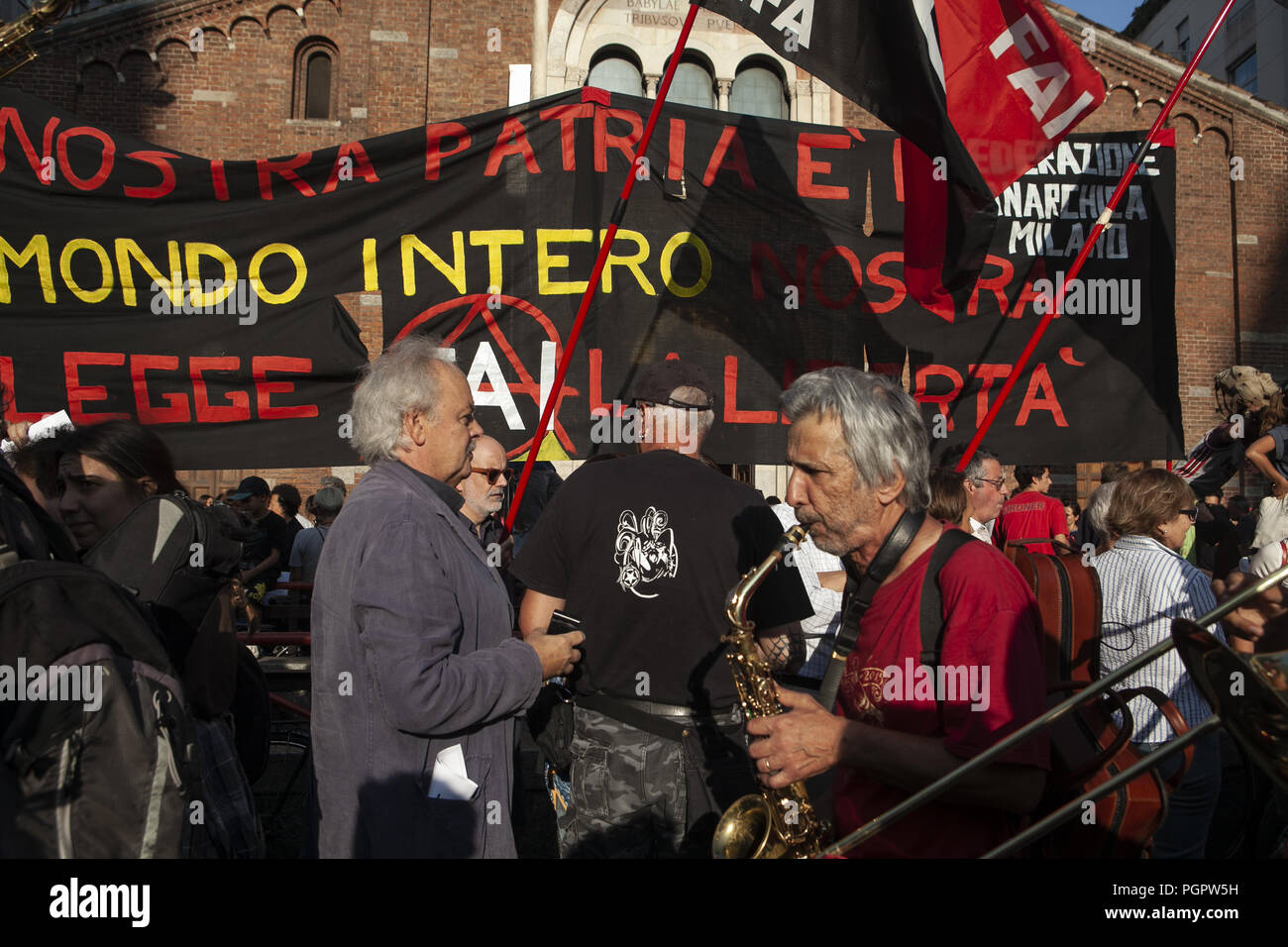 Milan, MI, Italy. 28th Aug, 2018. A group is seen playing instruments during the protest.Left-wing activists protest against the meeting of the Italian Deputy Premier and Interior Minister, Matteo Salvini, and the Hungarian Premier, Viktor OrbÃ¡n. Protestors refuse both common populist vision and anti-migrants' stances. Credit: Valeria Ferraro/SOPA Images/ZUMA Wire/Alamy Live News Stock Photo