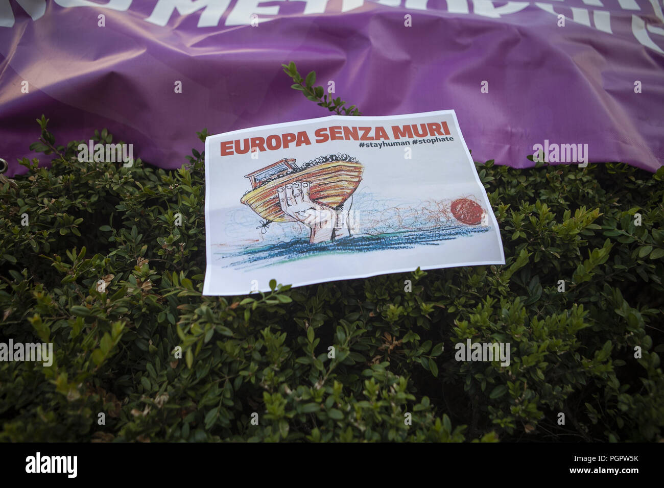 Milan, MI, Italy. 28th Aug, 2018. A poster and a banner seen during the protest.Left-wing activists protest against the meeting of the Italian Deputy Premier and Interior Minister, Matteo Salvini, and the Hungarian Premier, Viktor OrbÃ¡n. Protestors refuse both common populist vision and anti-migrants' stances. Credit: Valeria Ferraro/SOPA Images/ZUMA Wire/Alamy Live News Stock Photo