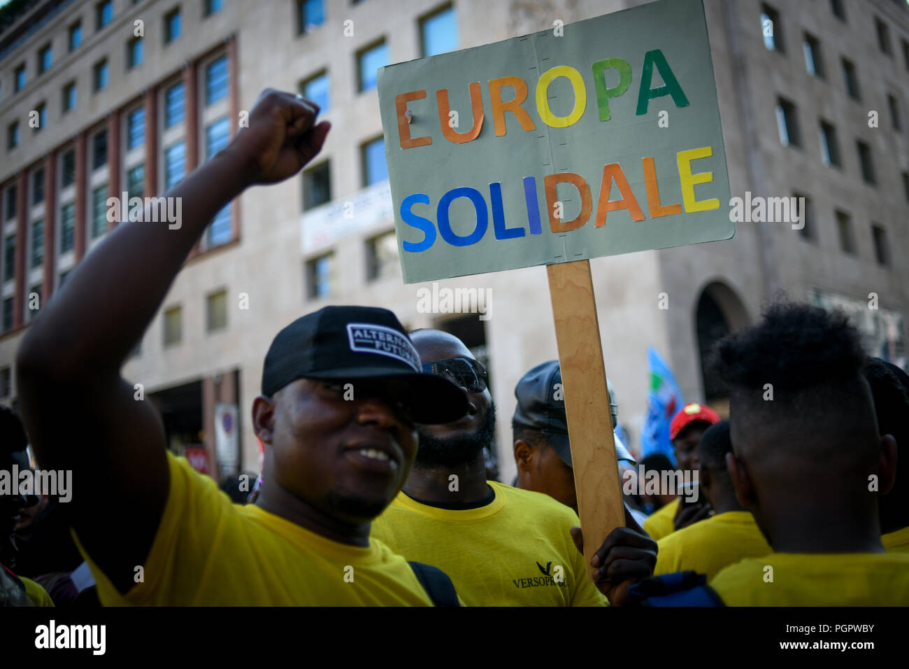 Milan, Italy. 28th Aug 2018. A man holds a placard reading 'Europa Solidale' (Solidary Europe) during a protest against the meeting between Prime Minister of Hungary, Viktor Orbán and Italian Interior Minister Matteo Salvini in Milan, Italy on August 28, 2018 Credit: Piero Cruciatti/Alamy Live News Stock Photo