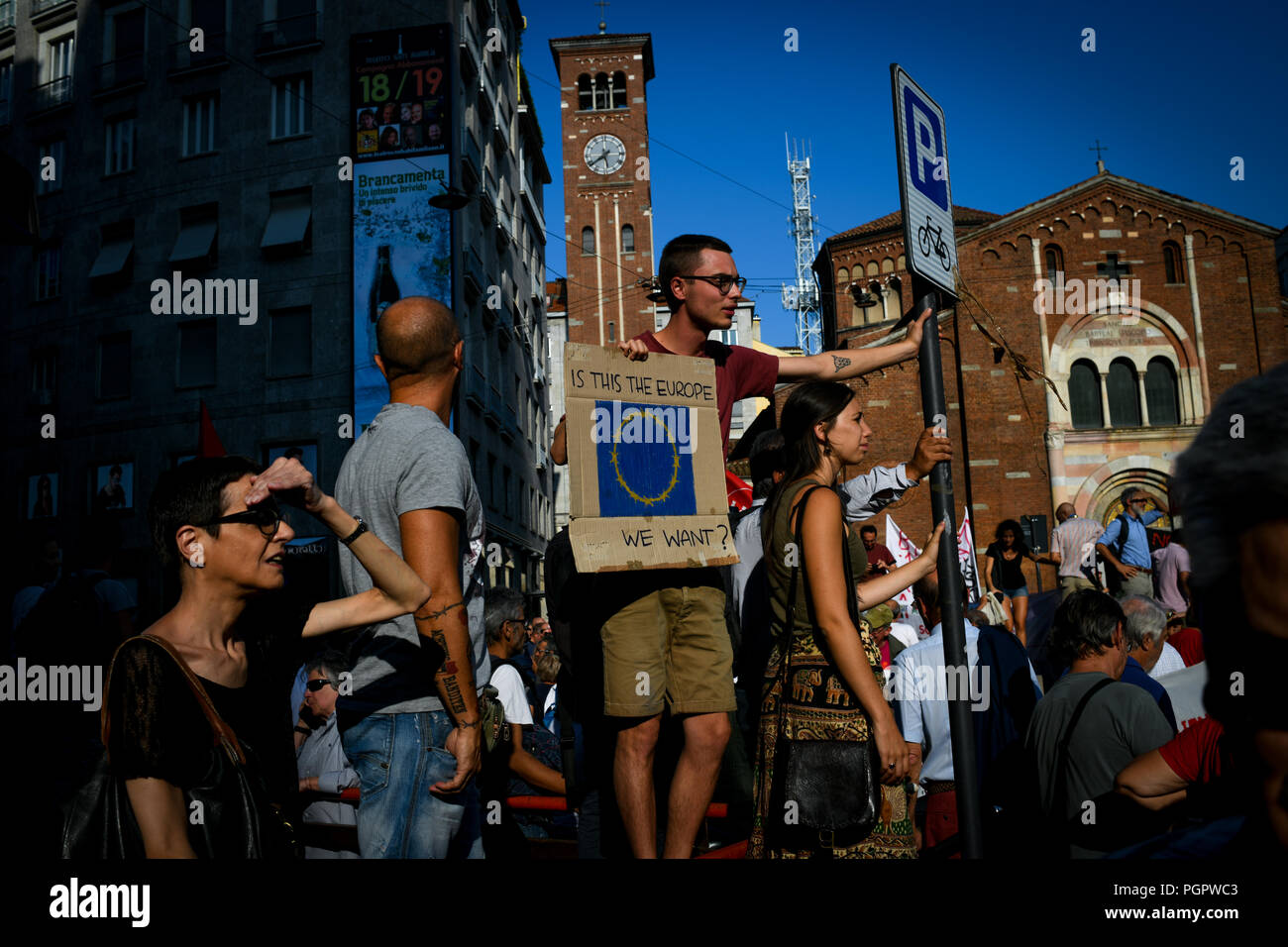 Milan, Italy. 28th Aug 2018. A young man holds a placard reading 'Is this the Europe we want?' during a protest called 'Europe without borders' against the meeting between Prime Minister of Hungary, Viktor Orbán and Italian Interior Minister Matteo Salvini in Milan, Italy on August 28, 2018 Credit: Piero Cruciatti/Alamy Live News Stock Photo