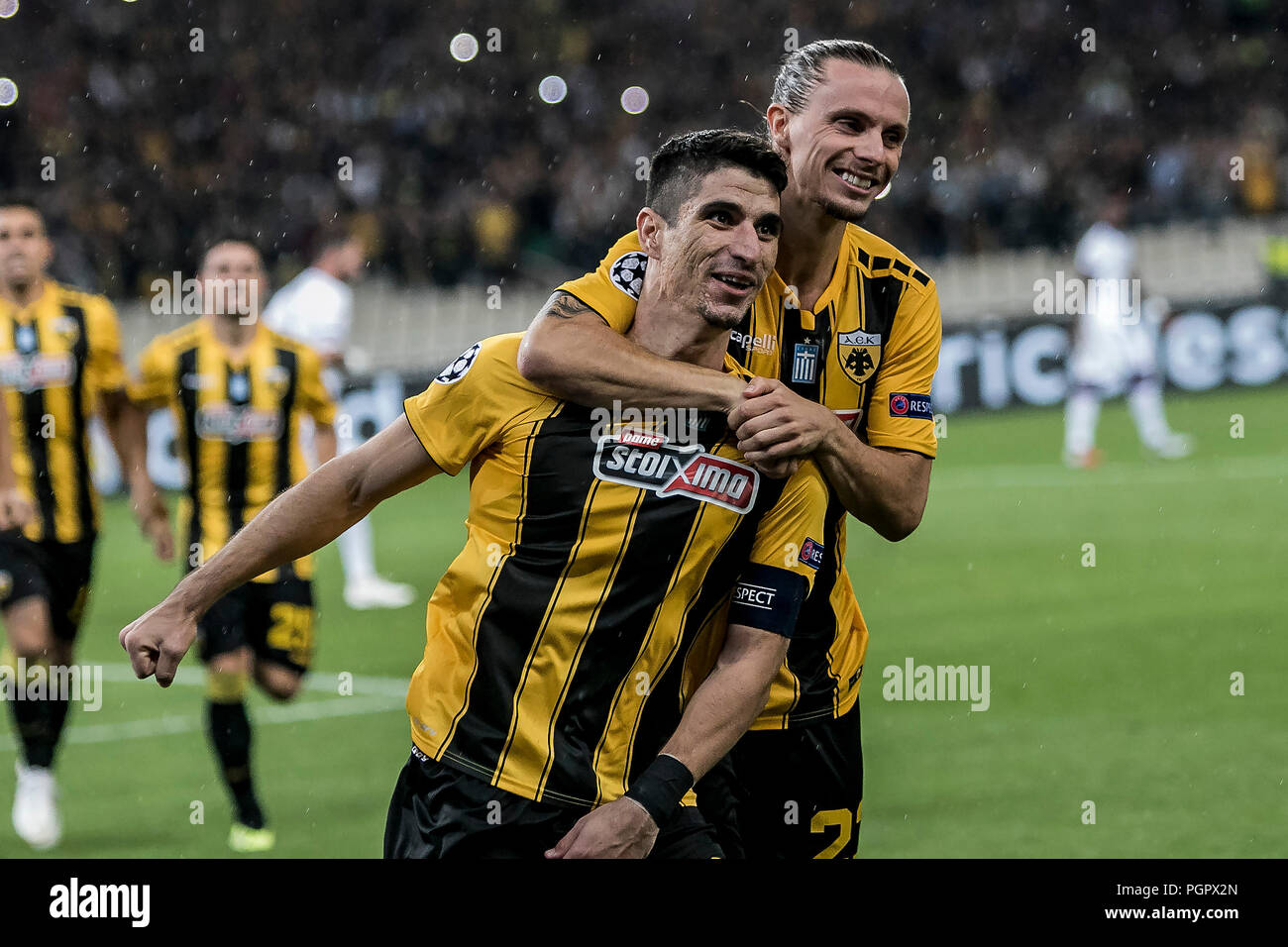 Athens, Greece. 28th Aug, 2018. AEK's Petros Mantalos (L) celebrates with  his teammates after scoring during the Champions League Play-Off leg 2  soccer match between AEK Athens and MOL Vidi FC at