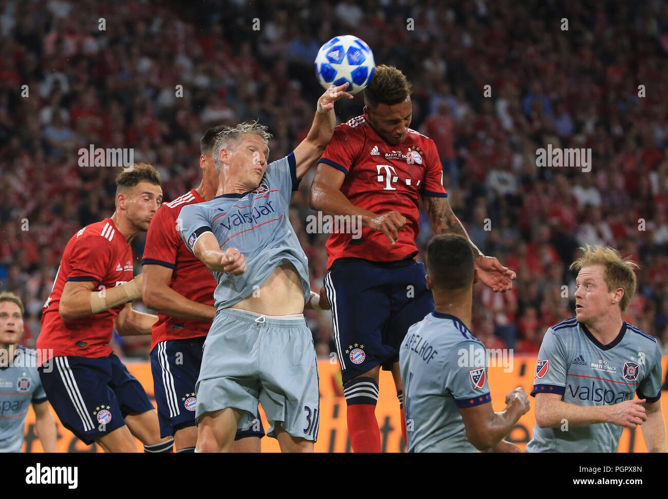 Munich, Germany. 28th Aug, 2018. German player Bastian Schweinsteiger (up L) vies with Bayern Munich's Corentin Tolisso (up R) during his farewell match between Bayern Munich of Germany and Chicago Fire of the United States, in Munich, Germany, on Aug. 28, 2018. A farewell match for German soccer player Bastian Schweinsteiger was held in Munich on Tuesday between Bayern Munich and Chicago Fire. He used to play for Bayern Munich from 1998 to 2015 and has been a member of Chicago Fire since 2017. Bayern Munich won 4-0. Credit: Philippe Ruiz/Xinhua/Alamy Live News Stock Photo