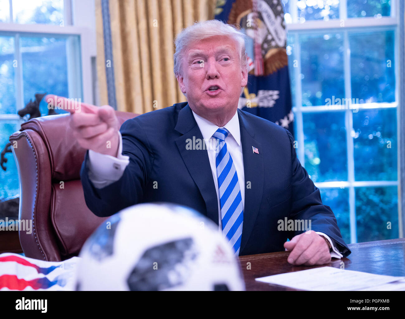 United States President Donald J. Trump, makes remarks as he meets with Gianni Infantino, left, President of Fédération Internationale de Football Association (FIFA) in the Oval Office of the White House in Washington, DC on Tuesday, August 28, 2018. FIFA describes itself as an international governing body of association football, futsal, and beach soccer. Credit: Ron Sachs/CNP /MediaPunch Stock Photo
