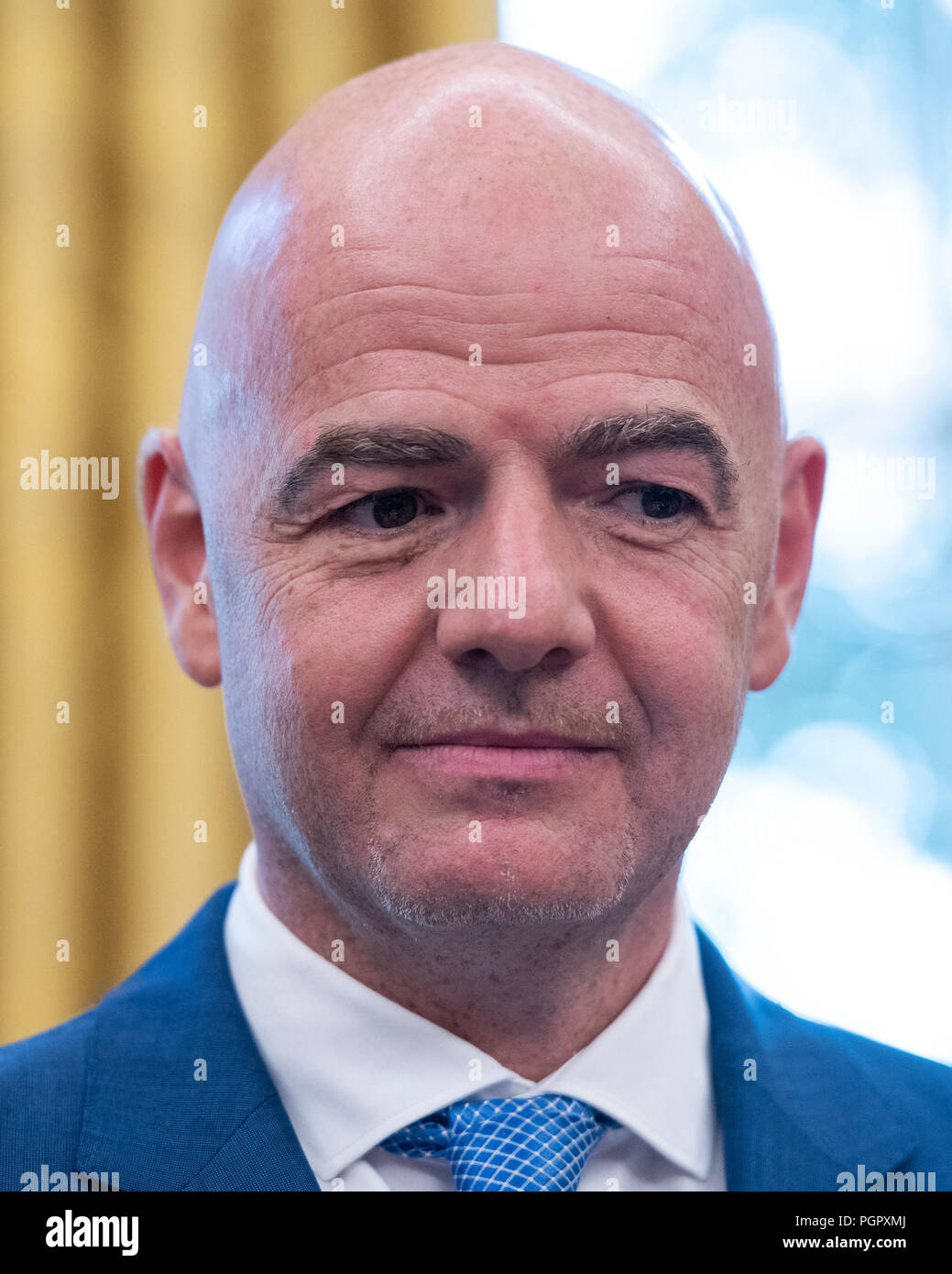 Gianni Infantino, President of Fédération Internationale de Football Association (FIFA) listens as United States President Donald J. Trump makes remarks in the Oval Office of the White House in Washington, DC on Tuesday, August 28, 2018. FIFA describes itself as an international governing body of association football, futsal, and beach soccer. Credit: Ron Sachs/CNP /MediaPunch Stock Photo