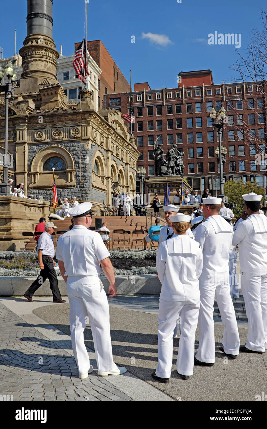 Cleveland, Ohio, USA. 28 Aug, 2018. Members of the US Navy wait for the opening ceremony for Navy Week in Cleveland, Ohio, USA to begin.  The ceremony at the the Soldiers' and Sailors' Monument includes honoring Senator John McCain for whom the US Flag is being flown at half-mast. Credit: Mark Kanning/Alamy Live News. Stock Photo