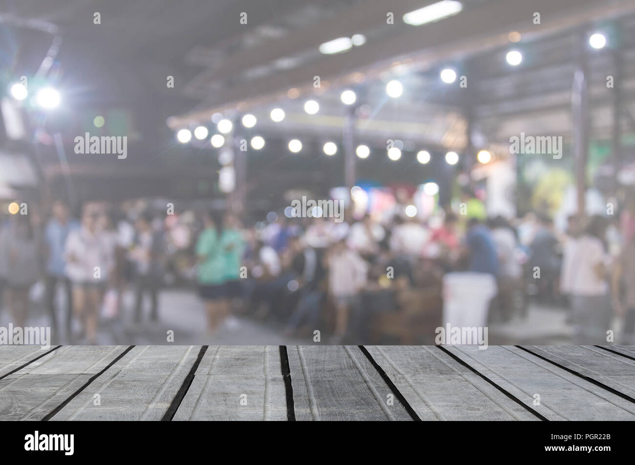 Wood Table Top And Abstract Blurred Festival Food Night Market