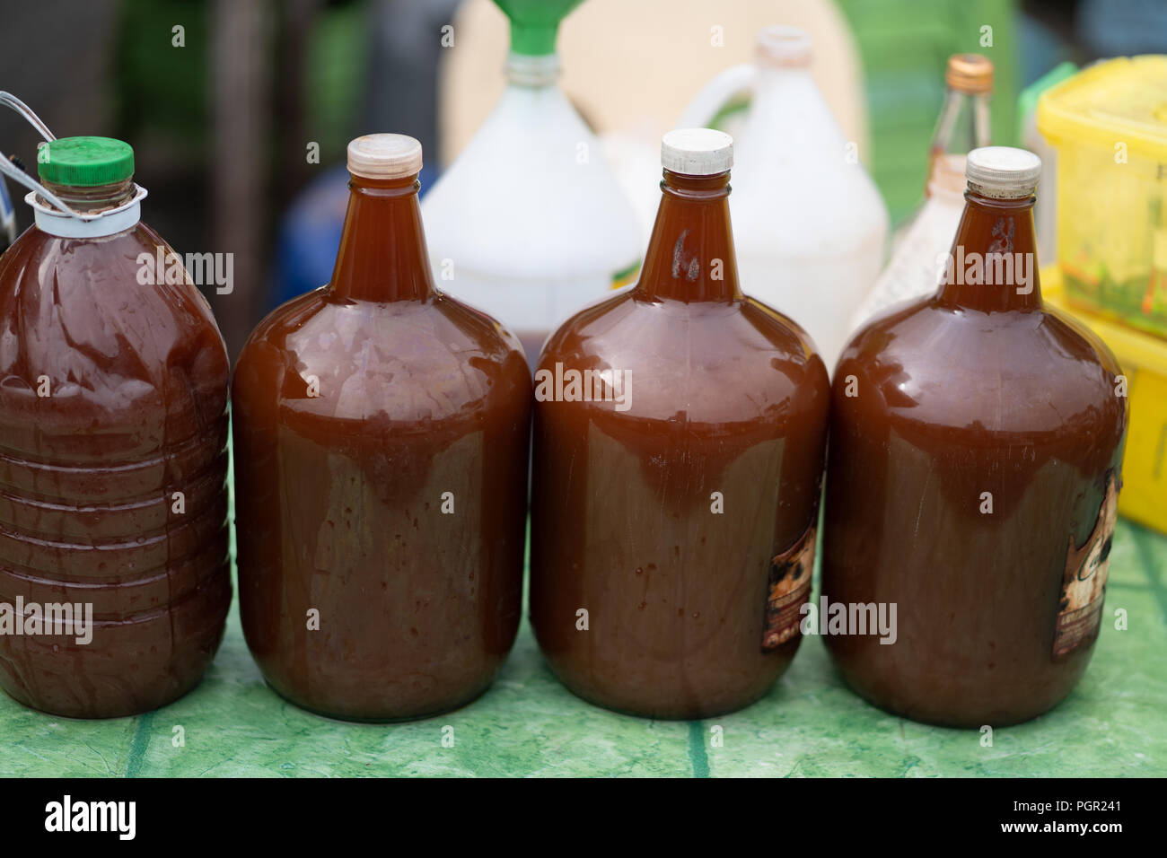 Large bottles of Tuba Coconut wine for sale within the Carbon Market,Cebu City,Philippines Stock