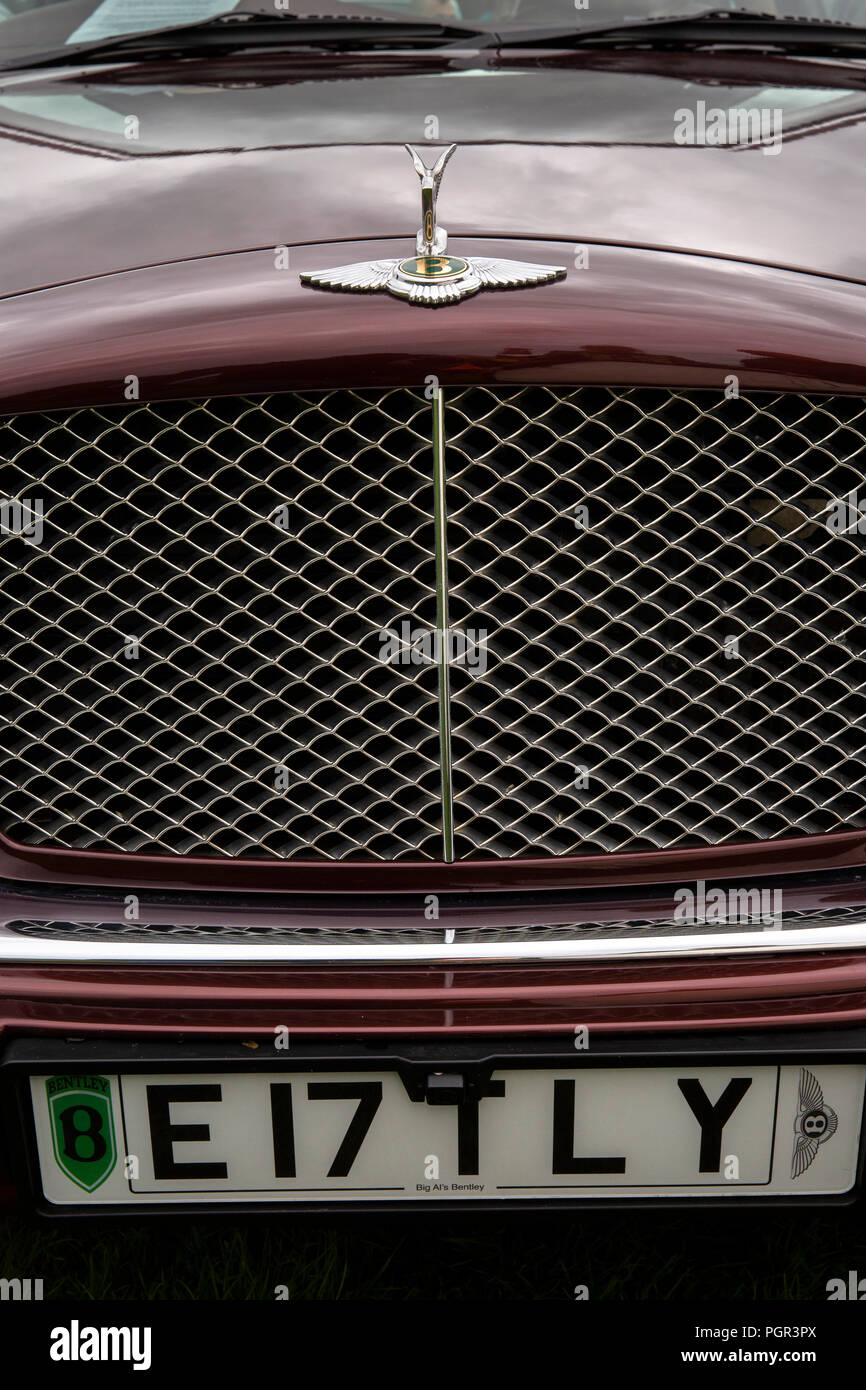 UK, England, Cheshire, Stockport, Woodsmoor Car Show, flying B badges on radiator of Bentley Arnage saloon car Stock Photo