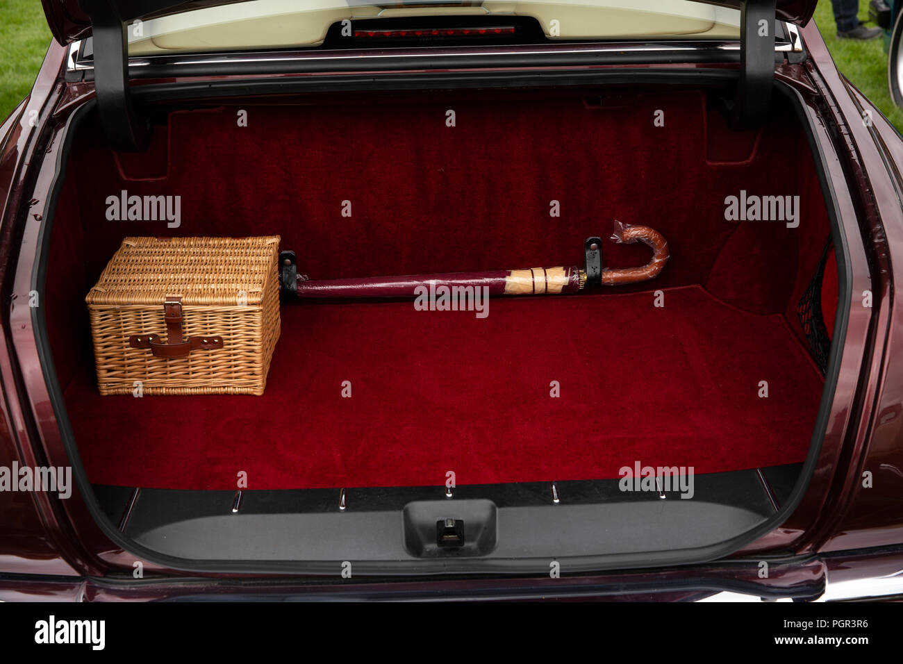 UK, England, Cheshire, inside boot of 1999 Bentley Arnage saloon car , with picnic basket and original umbrella Stock Photo