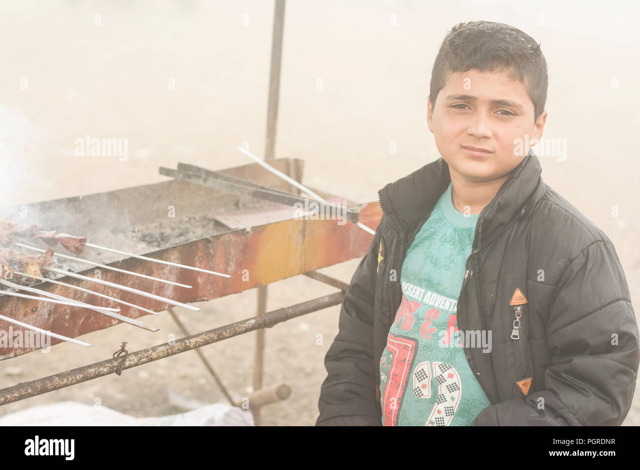 Gilan Province- IRAN-July 23, 2018 Portrait of a teenage boy making