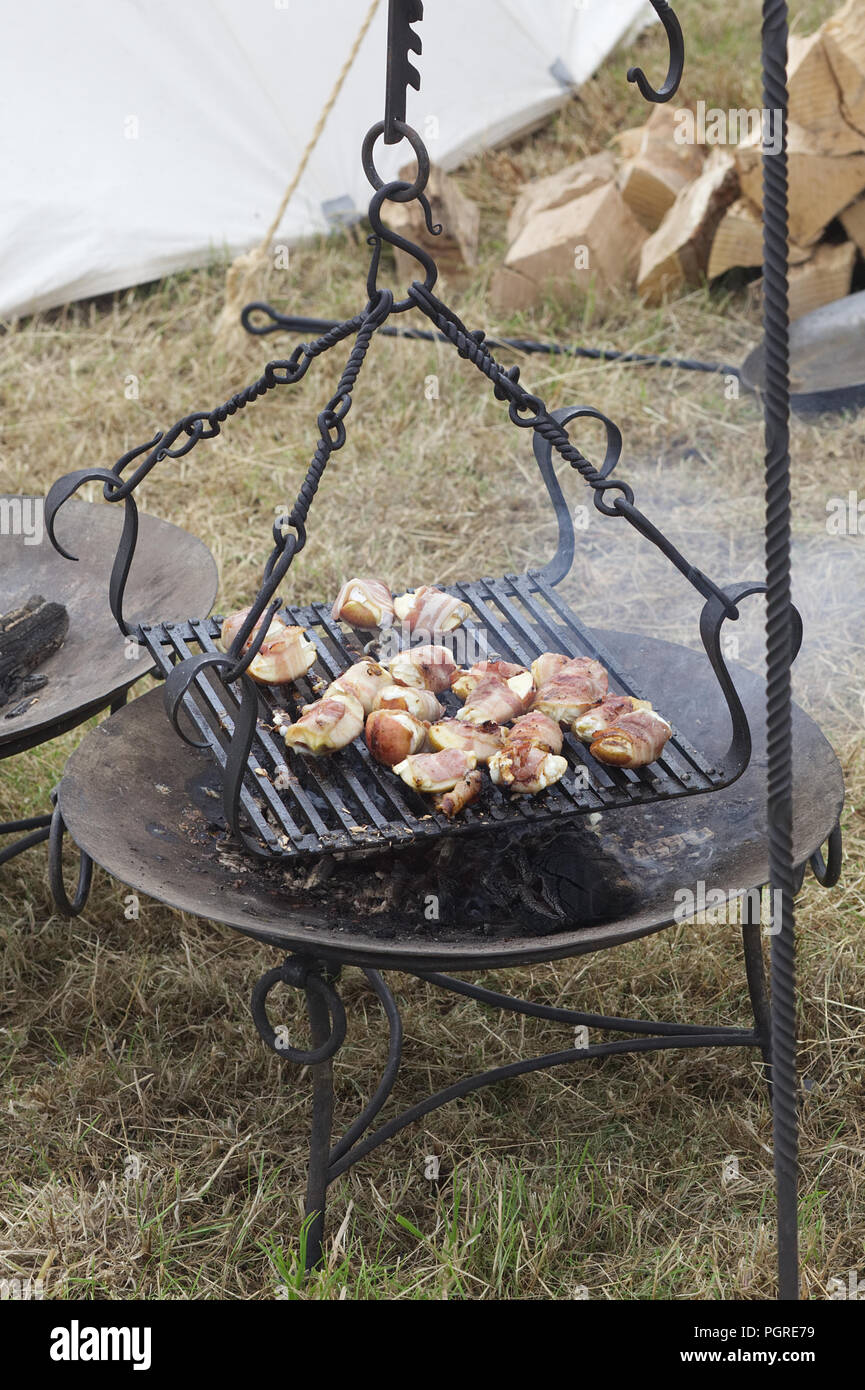 cooking chicken on a open range Stock Photo