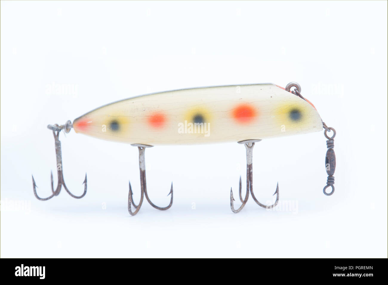 An old fishing lure, or plug, equipped with three treble hooks and designed to dive when reeled in. From a collection of vintage and modern fishing Stock Photo