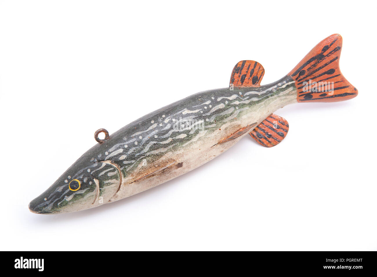 An old wooden decoy fish in the form of a pike. These lures were