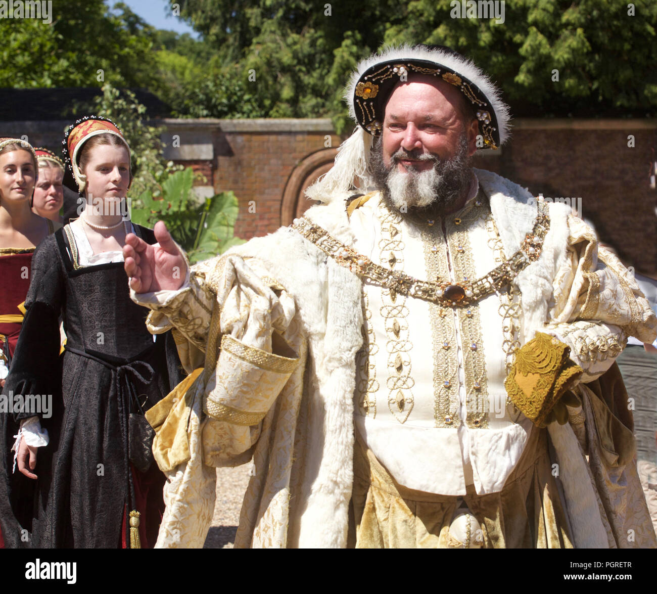 KIng Henry Eigth and courtiers (played by actors at Hamton Court Place London) Stock Photo