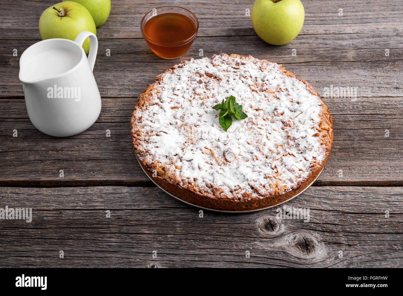 Homemade apple pie. It is lying on the wooden table. Stock Photo