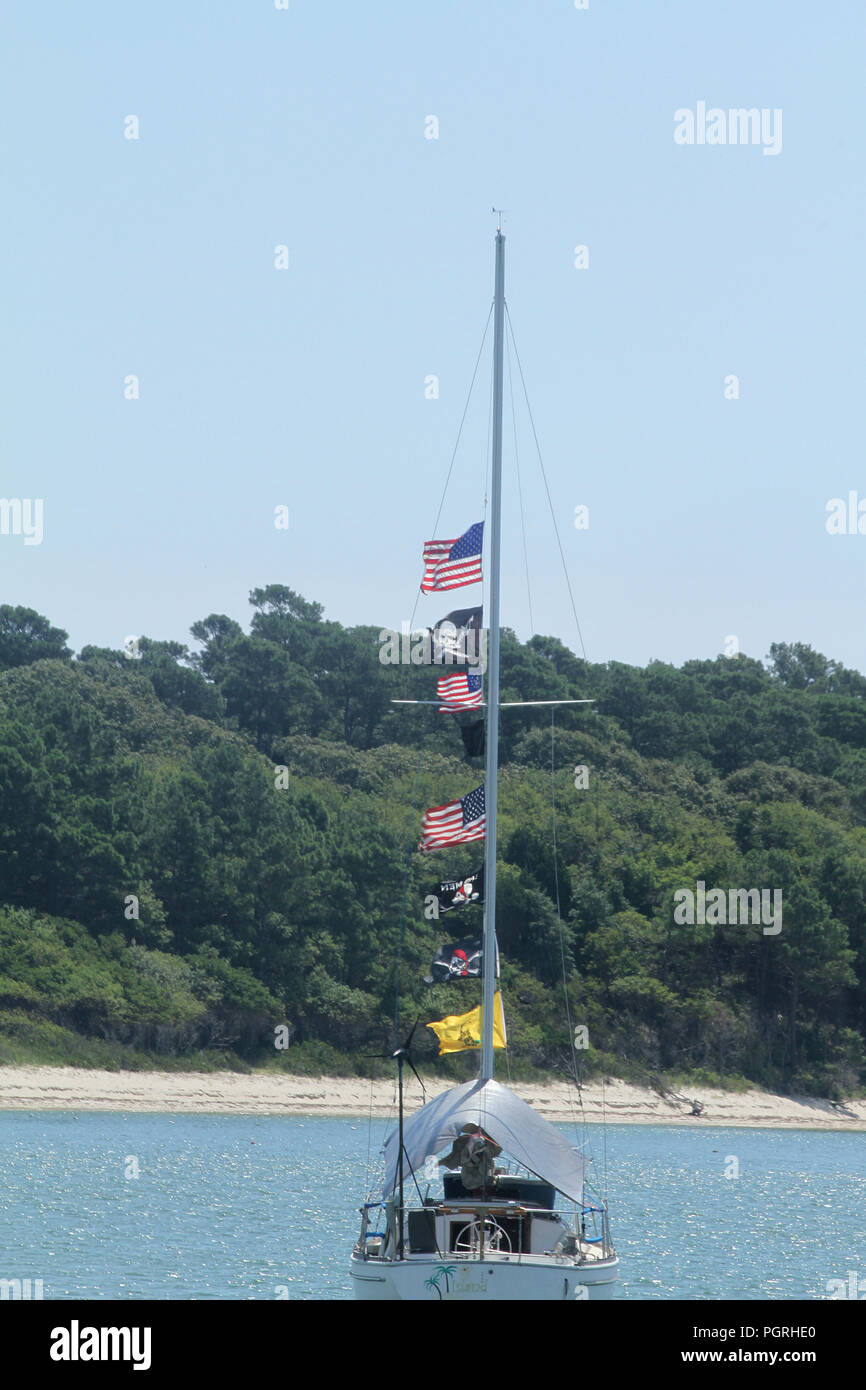 Private sailing ship displaying U.S.A. flags along with pirate flags