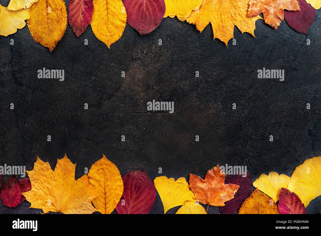 Top view of autumn leaves on dark background Stock Photo
