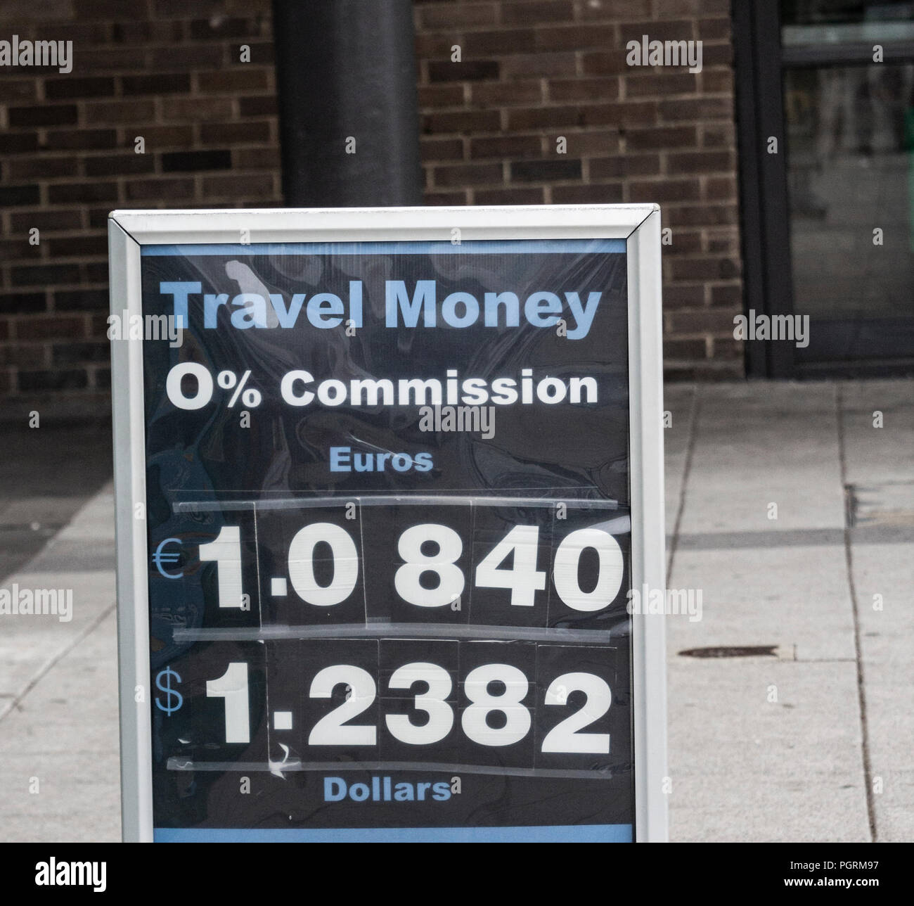 Tavel money, Euros and Dollars, exchange rate against pound sterling. Sign outside high street money exchange. UK. August 2018 Stock Photo