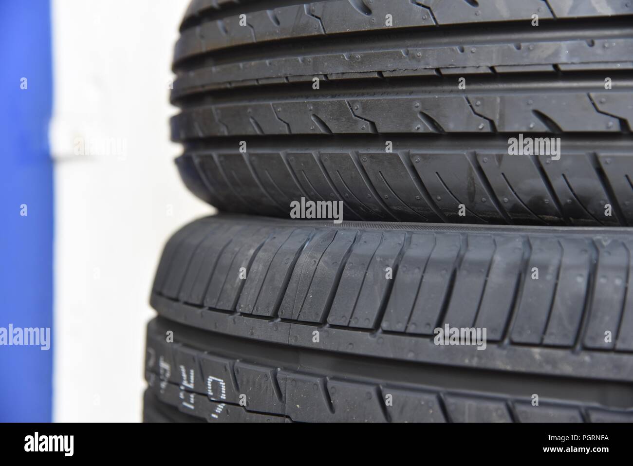 Tyre/tire fitting a close up of new tyres stacked outside a