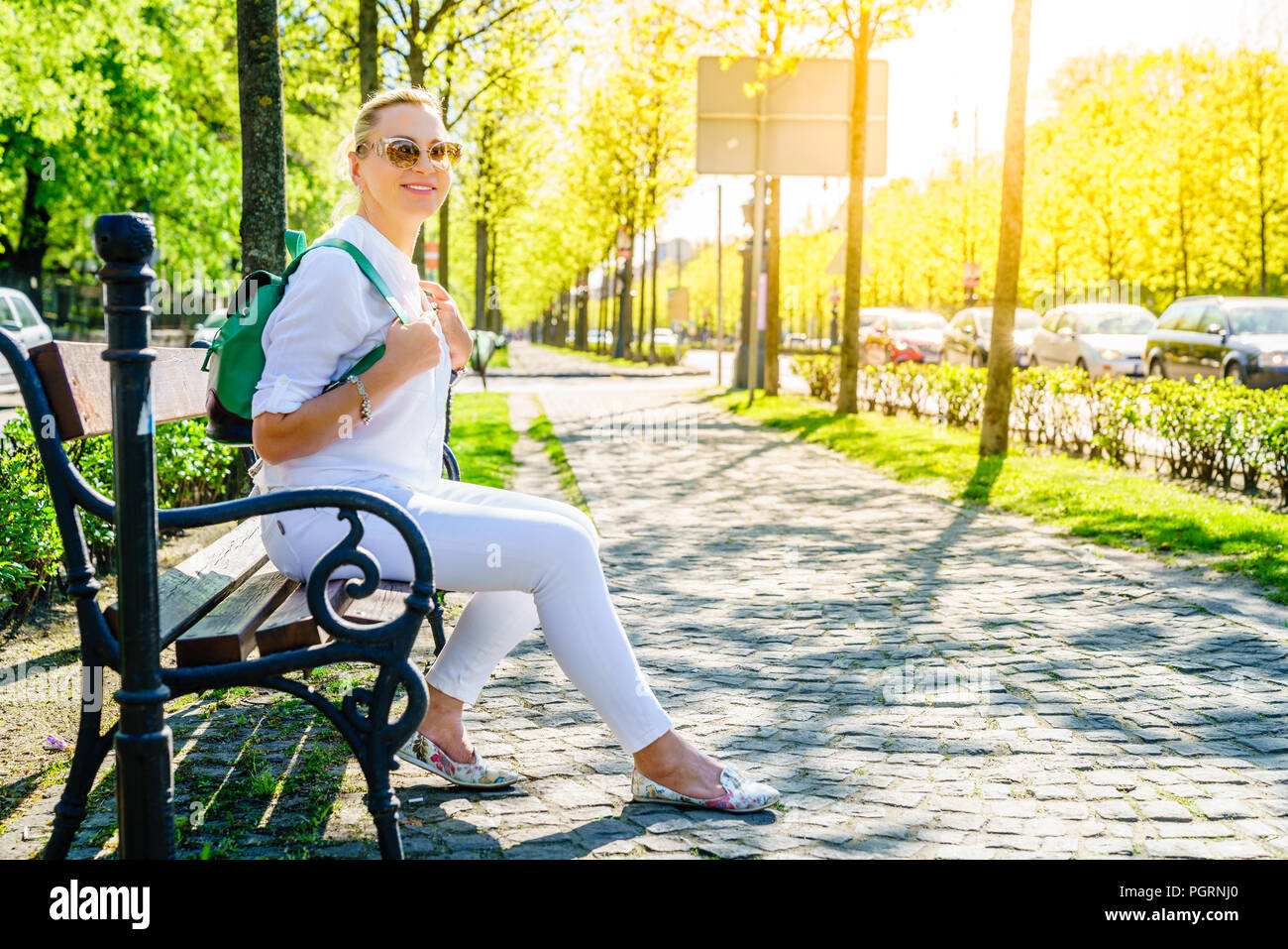 Woman tourist in the alley in Budapest on a sunny spring day Stock Photo