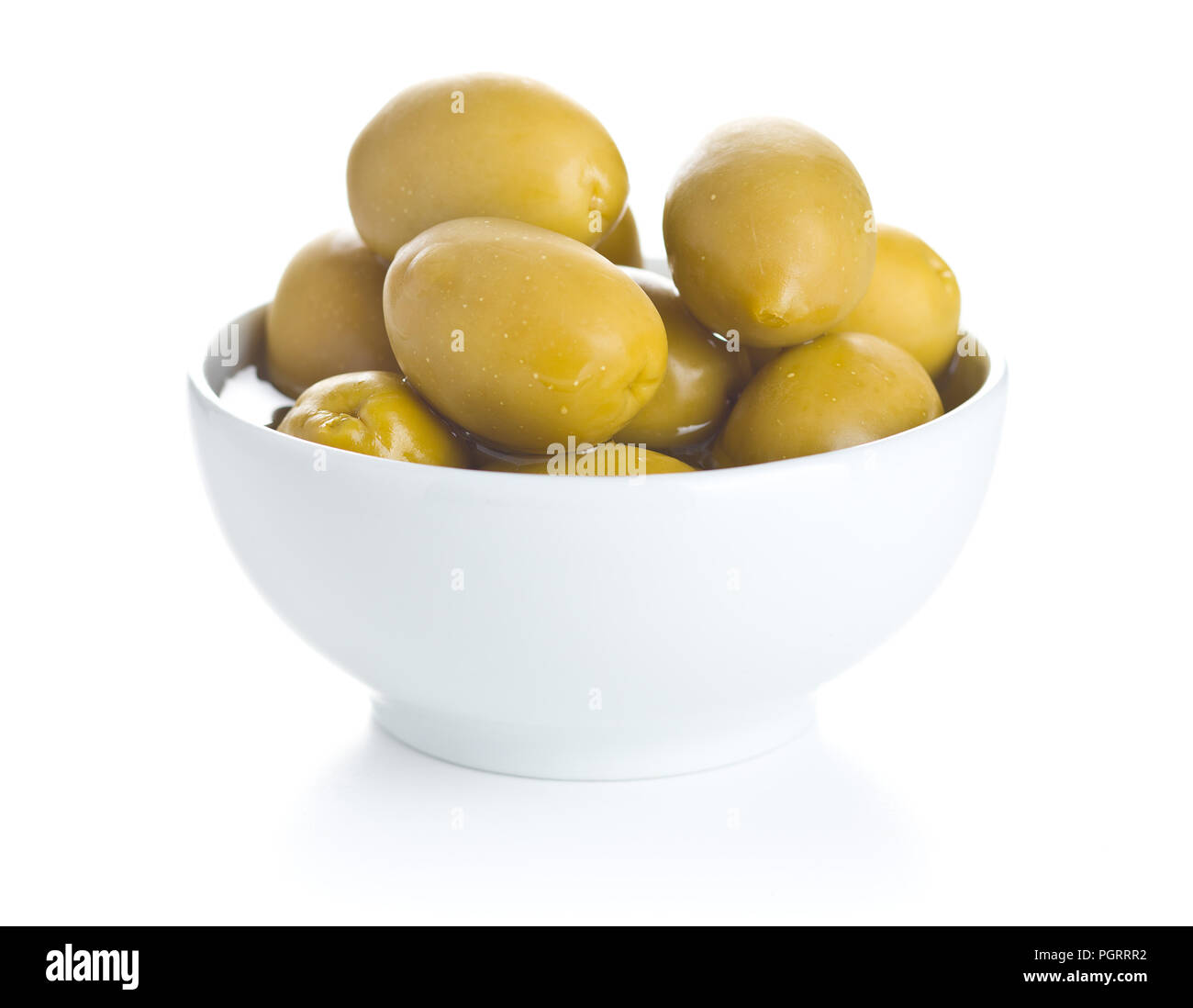 Green olives in bowl isolated on white background Stock Photo - Alamy