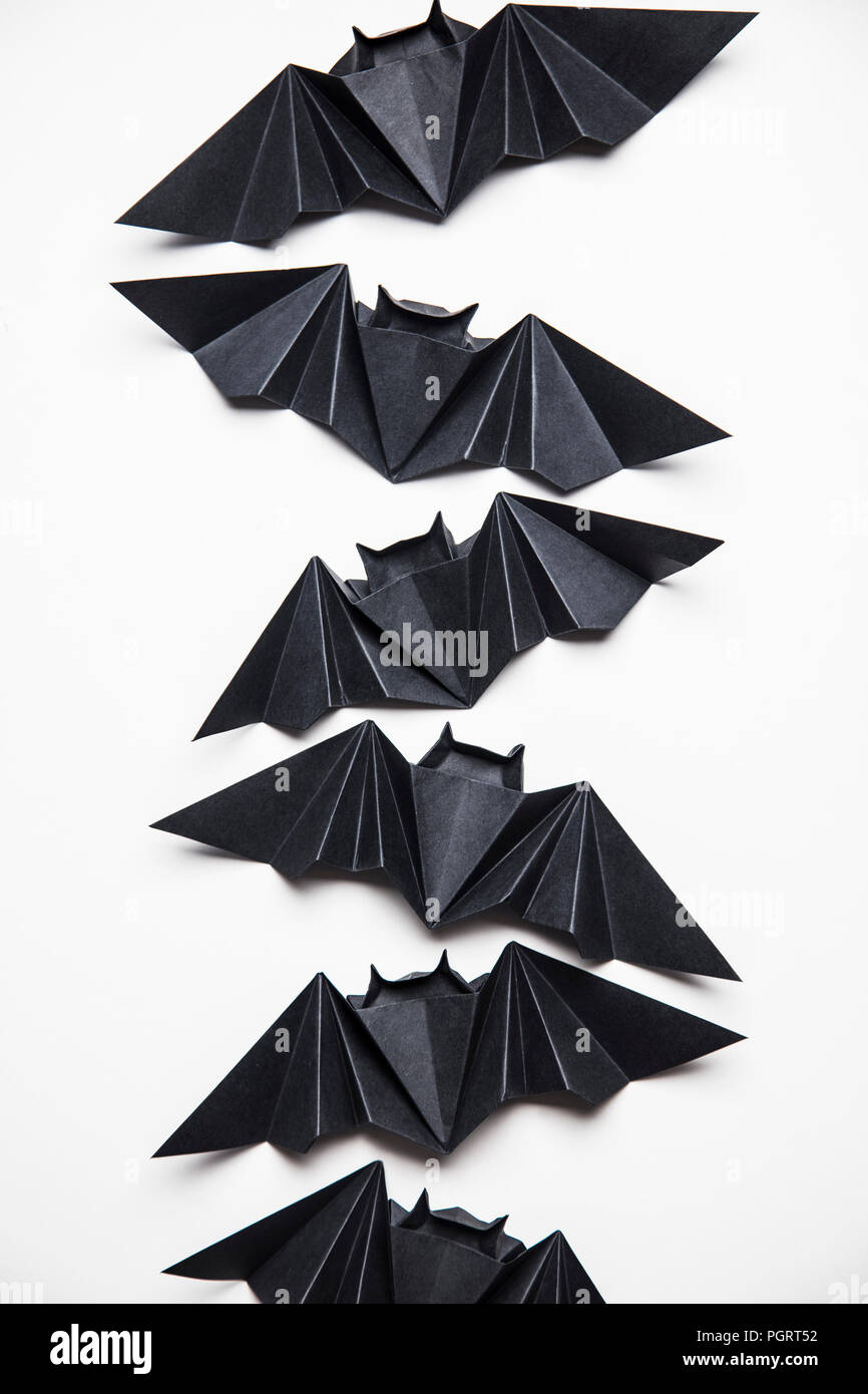 Halloween origami paper dracula bats on a white background Stock Photo -  Alamy