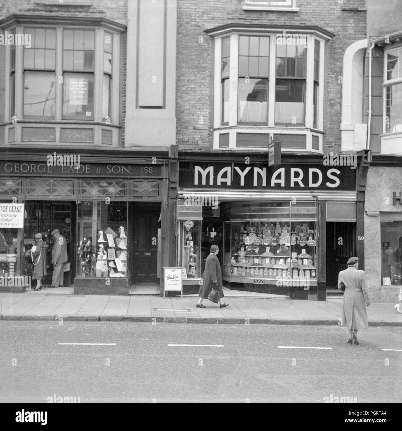 The businesses of George Eade and Maynards in Brighton on the South Coast of England, during the early 1960s. Stock Photo