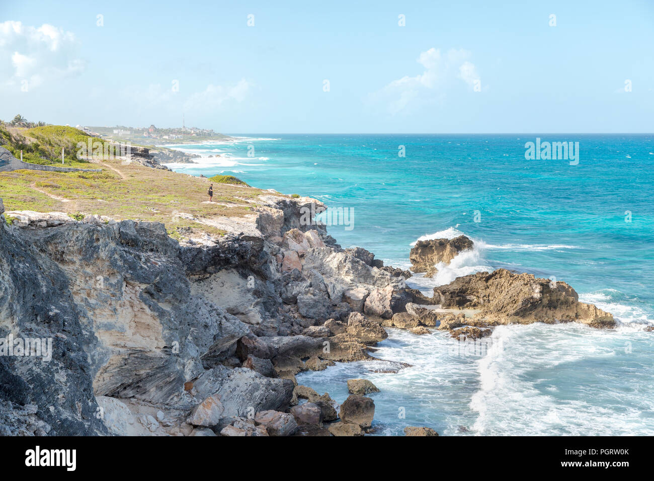 A man near a ocean-side cliff on Isla Mujeres. Stock Photo