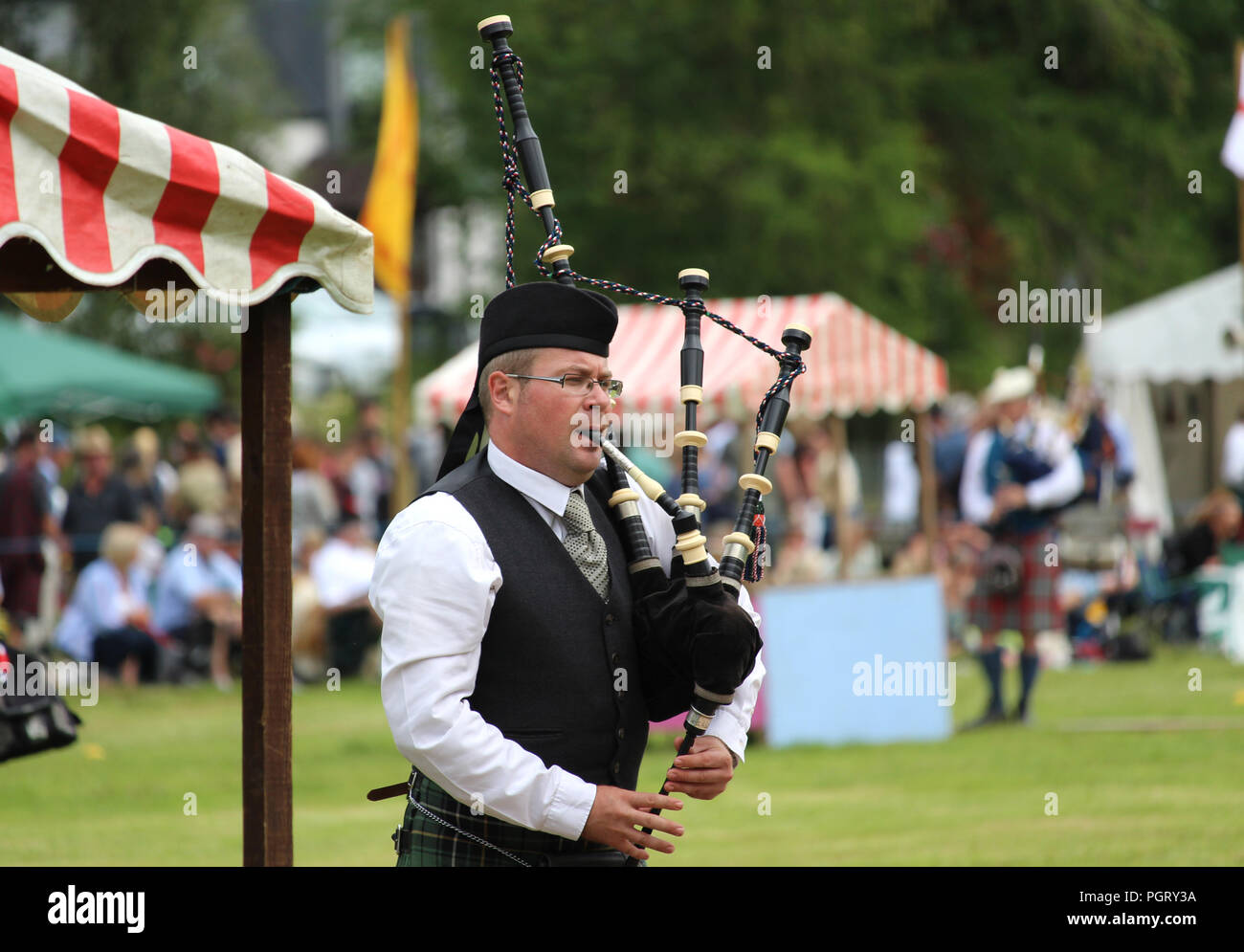 CRIEFF, SCOTLAND, 21 JULY 2018: Unknown competitors during the piping competition at the Lochearnhead highland Games near Crieff in Scotland. Stock Photo