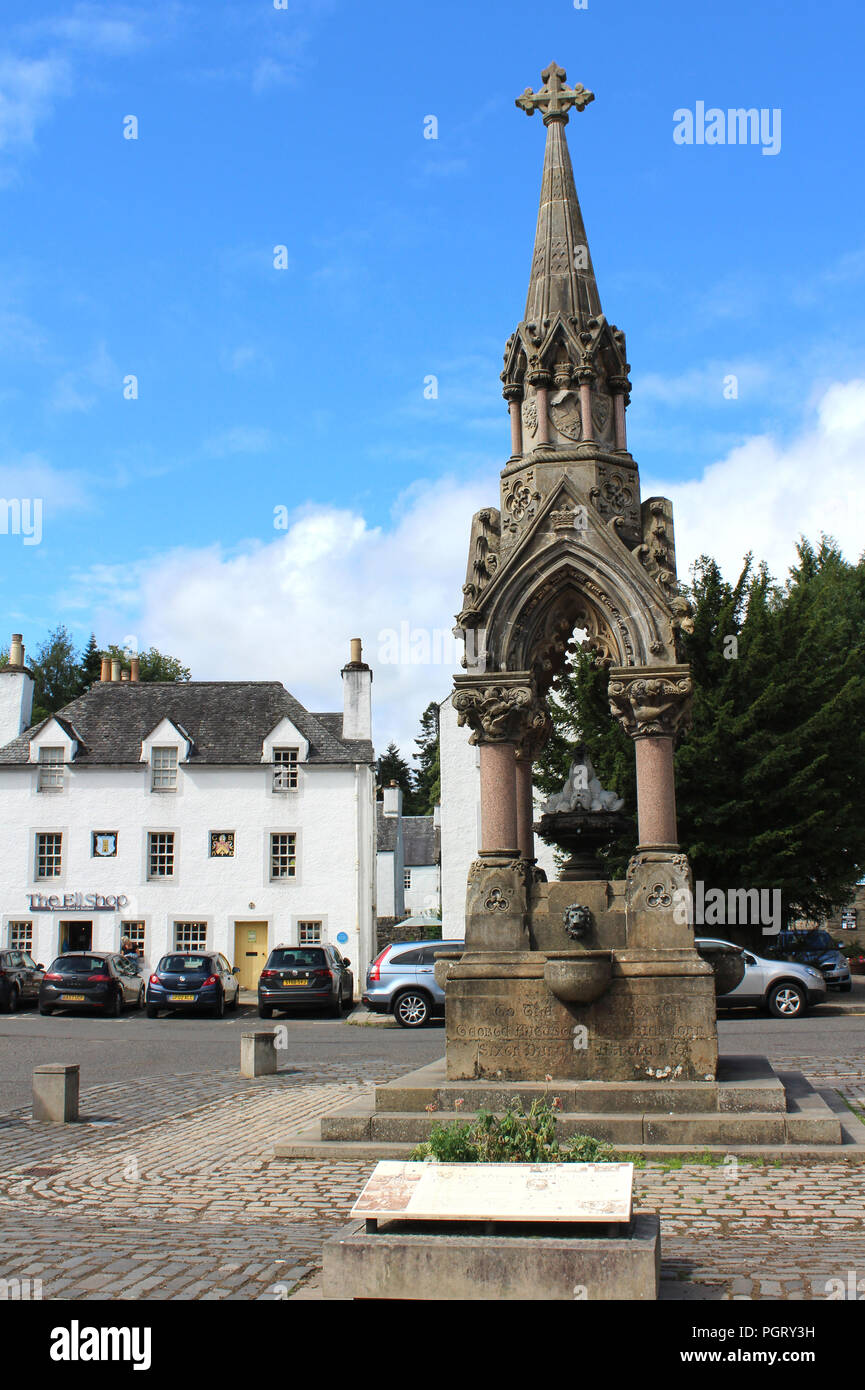 DUNKELD, SCOTLAND, JULY 23 2018: Atholl Memorial Fountain and the Historic Ell Shop on the High Street in Dunkeld. A town in Perthshire Stock Photo