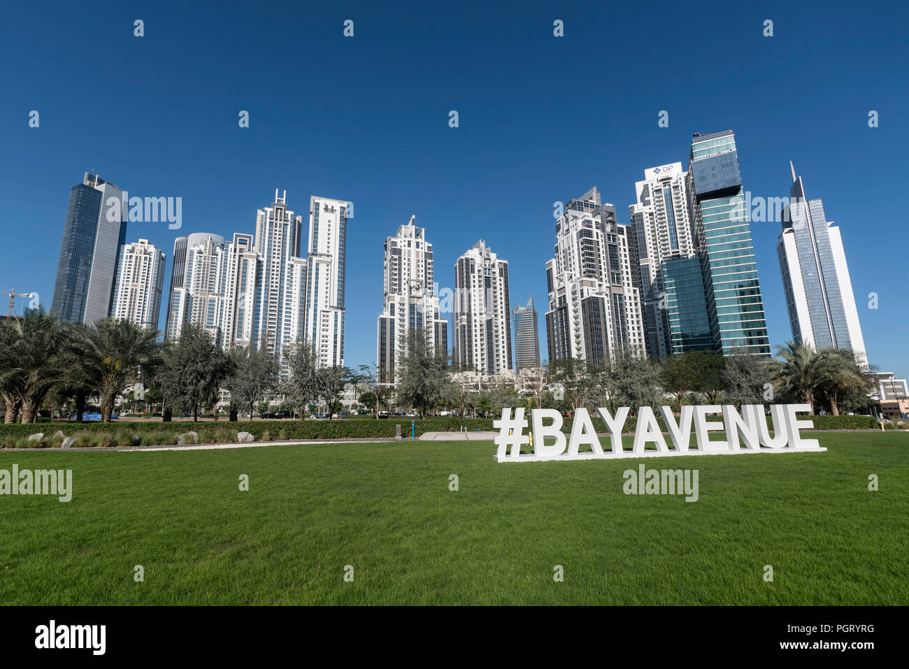Signage for Bay Avenue Mall, with the skyscrapers of Business Bay in the background, Dubai, UAE