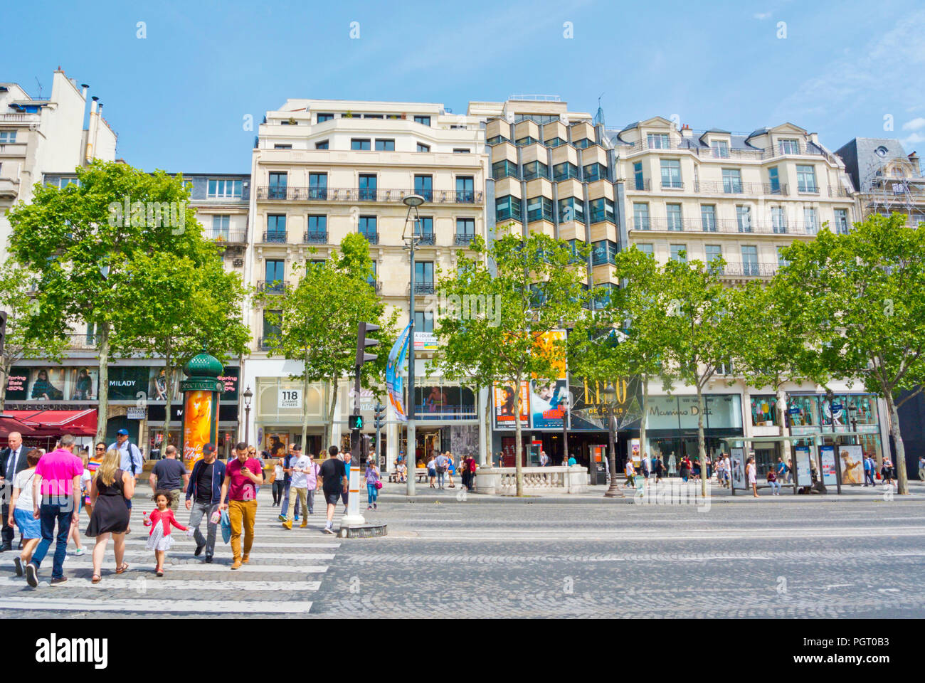 Pedestrians crossing Avenue des Champs-Élysées, 8th district, Paris, France Stock Photo